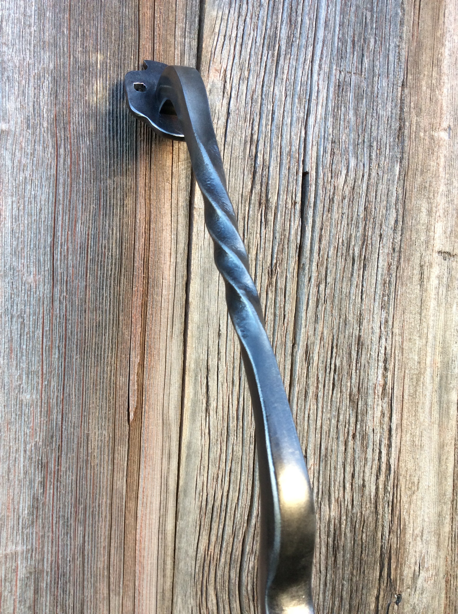 forged iron pull style door handle for interior loft or barn door. 24 inches long in brushed silver.