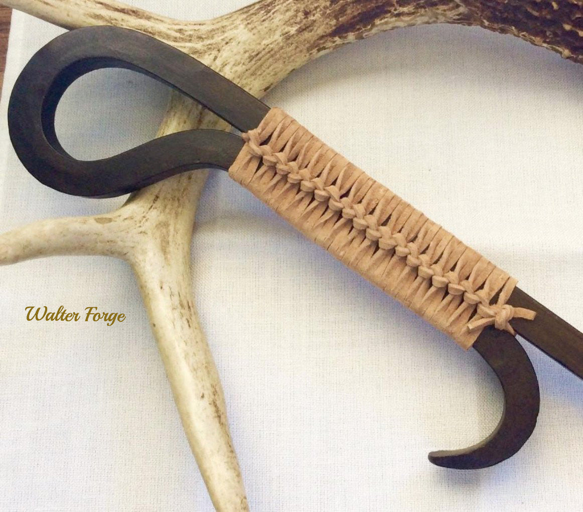 Braided suede on our fire poker handles give a comfortable grip.